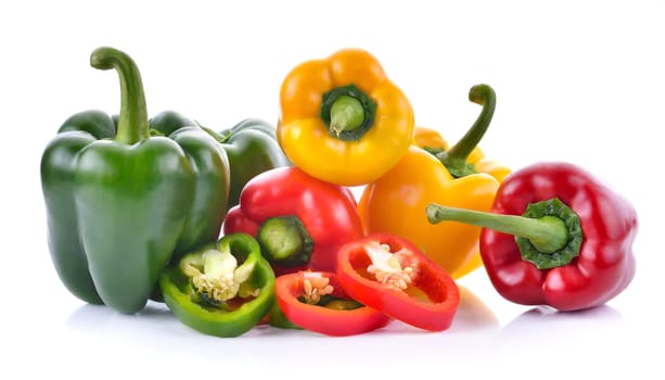 Red, green and yellow bell peppers isolated on white background. AI generated