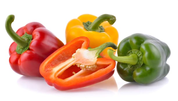 Red, green and yellow bell peppers isolated on white background. AI generated