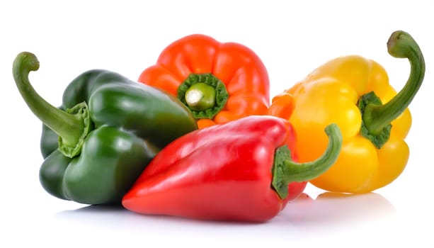 Red, green and yellow bell peppers isolated on white background. AI generated