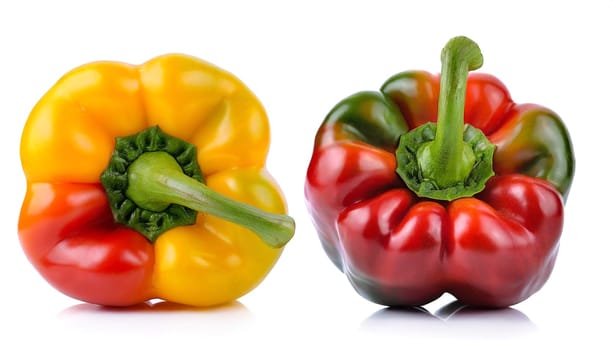 Red, green and yellow bell peppers isolated on white background. AI generated
