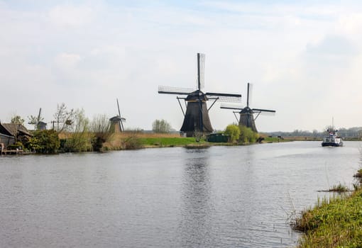 Kinderdijk, the Netherlands - April 17, 2023: 19 windmills at Kinderdijk built about 1740 is part of a larger water management system to prevent flooding. A UNESCO world heritage site.