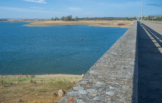 Float tube fisher close to Barragem do Caia wall, Campo Maior, Alentejo, Portugal