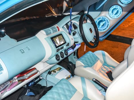 Music car of blue color and with blue illumination. Thailand, Phuket, the streets of the city.