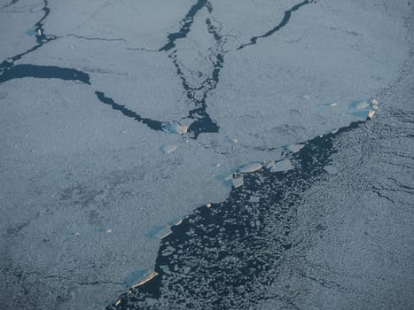 View of the Arctic ice from the plane, the expanses of the Arctic. View of the Arctic ice from the plane, the expanses of the Arctic.