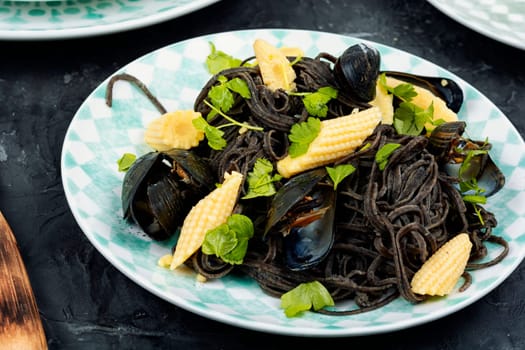 Vegan black bean pasta with clams, mussels. Mediterranean pasta vongole.