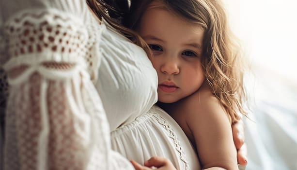 Woman standing and cute child touching with hands her big belly. Emotional loving pregnancy time 37 weeks. Baby expectation. Love, happiness and safety concept. Closeup. Happy family embrace