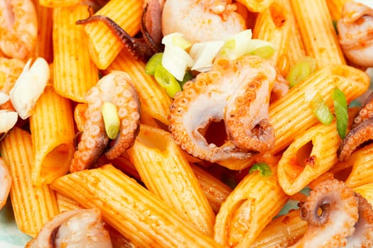 Delicious macaroni or pasta with octopus. Macaroni with seafood. American appetizer.