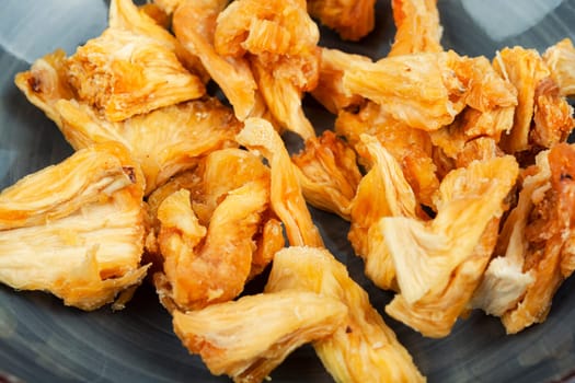 Delicious dry and fresh pineapples in bowls. Candy pineapples or ananas.