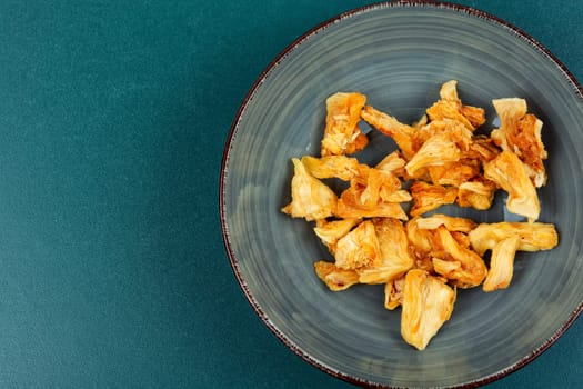 Delicious dry and fresh pineapples in bowls. Candy pineapples or ananas.