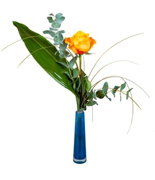 Closeup of an isolated flower arrangement with a rose in a glass vase
