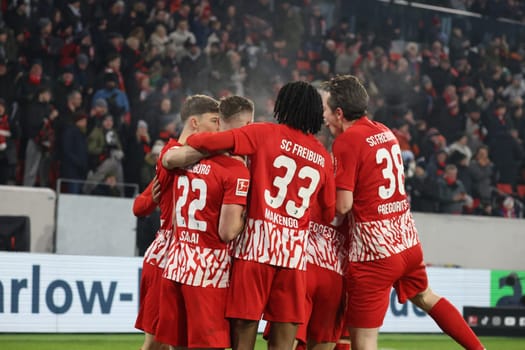 The Freiburg players celebrate the 3:2 winning goal of Roland Sallai (SC Freiburg) in the match of the 1. FBL: 23-24: 18 Sptg. SC Freiburg - TSG 1899 Hoffenheim  DFL REGULATIONS PROHIBIT ANY USE OF PHOTOGRAPHS AS IMAGE SEQUENCES AND/OR QUASI-VIDEONann  Photo: Joachim Hahne/johapress