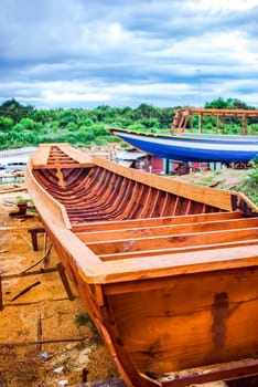 Construction of a new fishing wooden boat in Thailand. Wooden boat