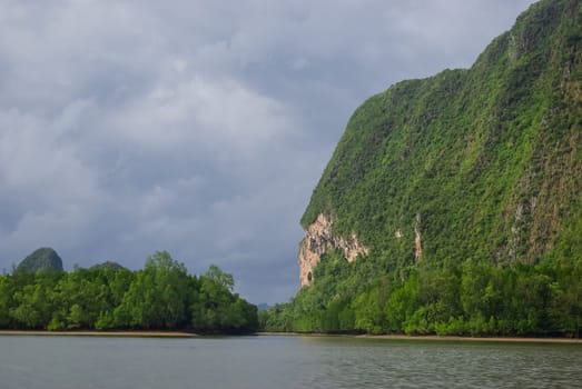 The nature of the coast of Thailand, cliffs near the sea, coastline and mountains.