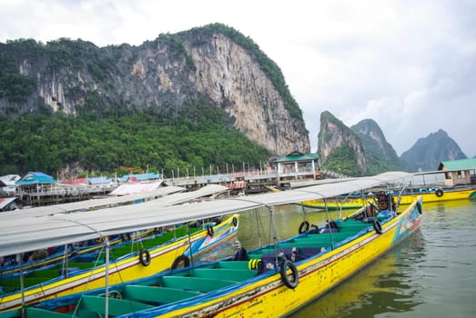 Phuket, Thailand - July 23, 2014: Fishermen on boats fishing in the sea in Thailand.