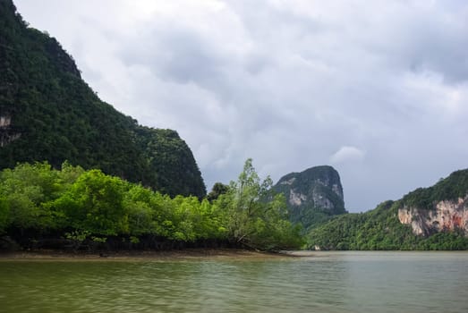 The nature of the coast of Thailand, cliffs near the sea, coastline and mountains.