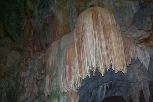 Karst cave, stalactites and stalagmites in a cave in Thailand.