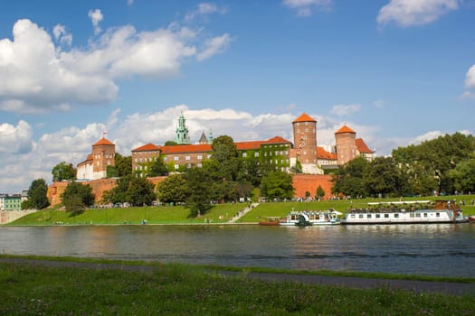 Wawel hill with castle in Krakow. Picturesque landscape on coast river Wisla.