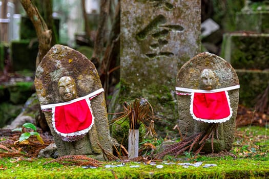 stone memorial statues inside the Okunoin Koyasan cemetery