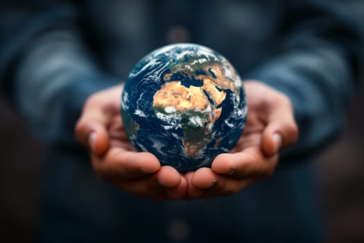 Man holding planet Earth in hands, safe Africa concept