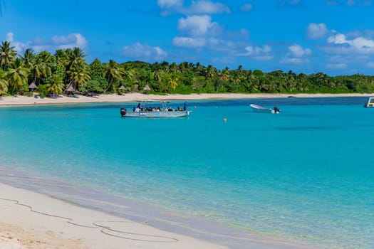 Nacula, Fiji: 26 May 2023: Tourist boats at the tropical sandy beach of Nacula island, Yasawa islands, Fiji, South Pacific Islands, Pacific