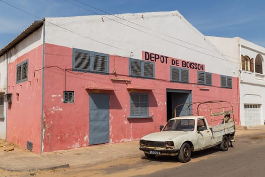 Dakar, Senegal: 28 January 2019: Old car and house on the waterfront, Goree Island, Senegal