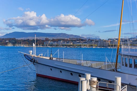 Geneva, Switzerland: November,15 2023: Boat on Lake Geneva. Lake Geneva iis a lake on the north side of the Alps, shared between Switzerland and France.