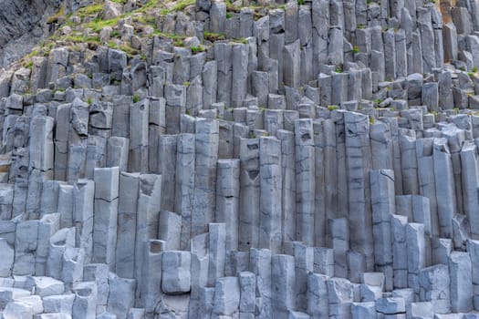 Grey basalt columns of varying height and thickness and depth, near Vik in south Iceland.