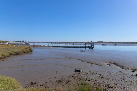 Mudflats at the estuary of the Tagus river near the Vasco da Gama bridge Lisbon, Portugal.