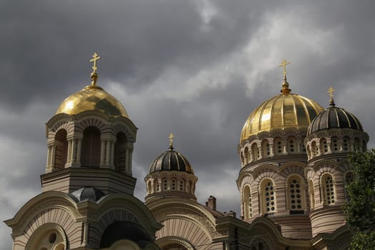Nativity of Christ Cathedral framed in autumn in cloudy weather. Riga, Latvia
