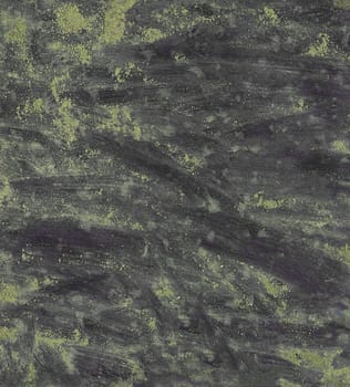 Texture of a grunge background with sand spots and streaks close-up from above
