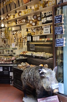 San Gimignano, Italy - Sept 17, 2022: A shop selling local and typical italian produce in the historic center of San Gimignano, Tuscany.