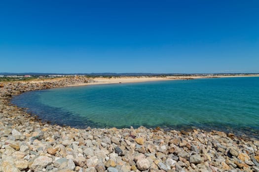 Beautiful empty beach in Algarve south coast, near Faro, Portugal