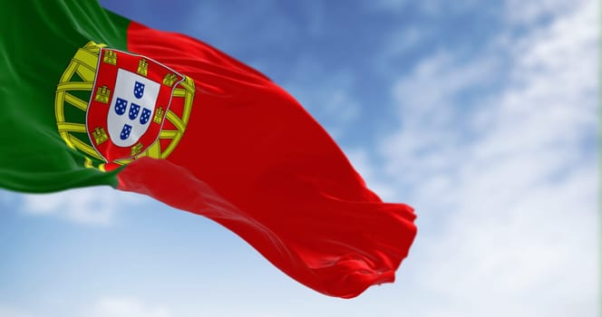 Portugal national flag waving in the wind on a clear day. Portuguese Republic is a Member State of the European Union. 3d illustration render. Fluttering fabric