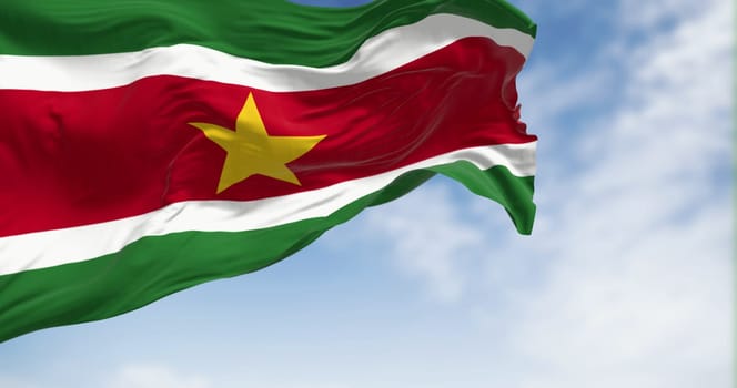Suriname national flag waving in the wind on a clear day. 5 horizontal bands: green, white, red, white, green, yellow star in the center. 3D illustration render. Fluttering textile