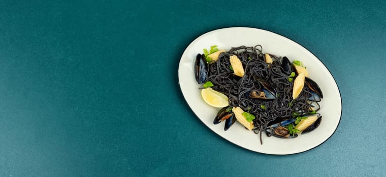 Vegan black bean pasta with mussels. Spaghetti with seafood. Pasta vongole. Space for text.