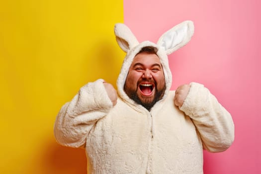 Portrait of a happy over weight man in a funny easter bunny costume