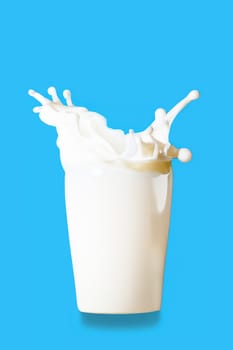 Glass of milk with splashes isolated on blue background