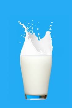 Glass of milk with splashes isolated on blue background