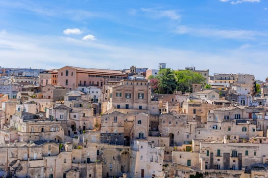 Matera, Italy - 6 May 2023: Ancient Unesco heritage old town of Matera (Sassi di Matera), Basilicata, southern Italy. Prehistoric cave dwellings