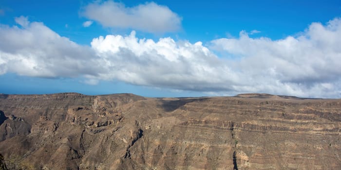 Mountains on the Canary Island of Gran Canaria in Spain, with blue sky and clouds
