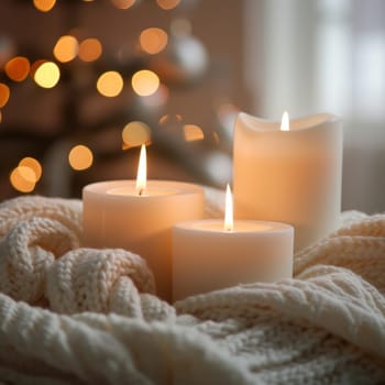 Cozy ambiance with three lit candles on a soft knit blanket, warm glow against a bokeh light background