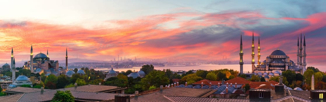 Sunset panorama over Hagia Sophia and the Blue Mosque of Istanbul, view on the city skyline, Turkey.