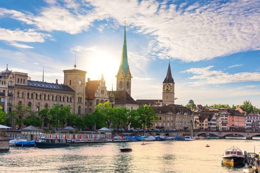 Wonderful sunset over St. Peter's church and Fraumunster abbey, Zurich, Switzerland.