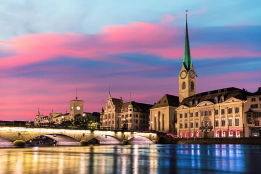 Fraum nster abbey or Women's Minster at sunset, the most popular church of Zurich, Switzerland.