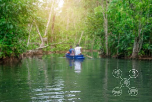 Green tourism, Sustainable tourism, Eco tourism and Ecosystem and preserve nature concept, River in forest and tree with person and boat, Botanical, Tree and river in forest blurred background, Travel nature conservation