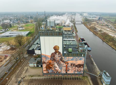 LOCHEM, NETHERLANDS - JANUARY 20, 2024: Artwork on a large building as part of the Achterhoek  Silo Art Tour, whereby barns, silos and other agricultural buildings have been transformed into works of art.
