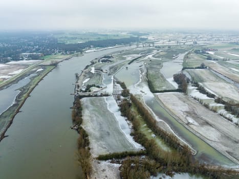 aerial view of the IJssel river with floodplains after high water