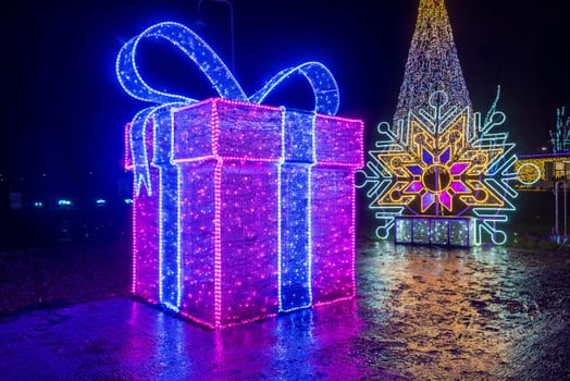 KRAKOW, POLAND - DECEMBER 25, 2023: Smurfs exhibition in the Garden of Light during Christmas time