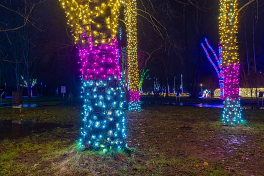 KRAKOW, POLAND - DECEMBER 25, 2023: Smurfs exhibition in the Garden of Light during Christmas time