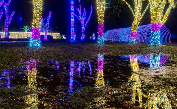 KRAKOW, POLAND - DECEMBER 25, 2023: Smurfs exhibition in the Garden of Light during Christmas time